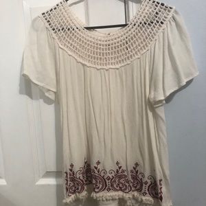 White nice shirt with red detail on bottom!